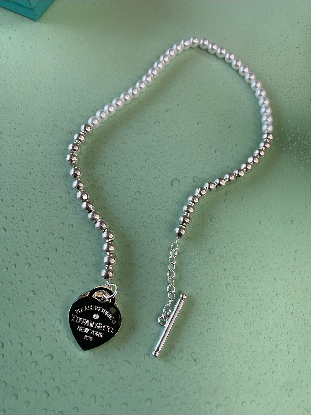 Tiffany & Co. Silver and White Pearl Bracelet with Heart Tag